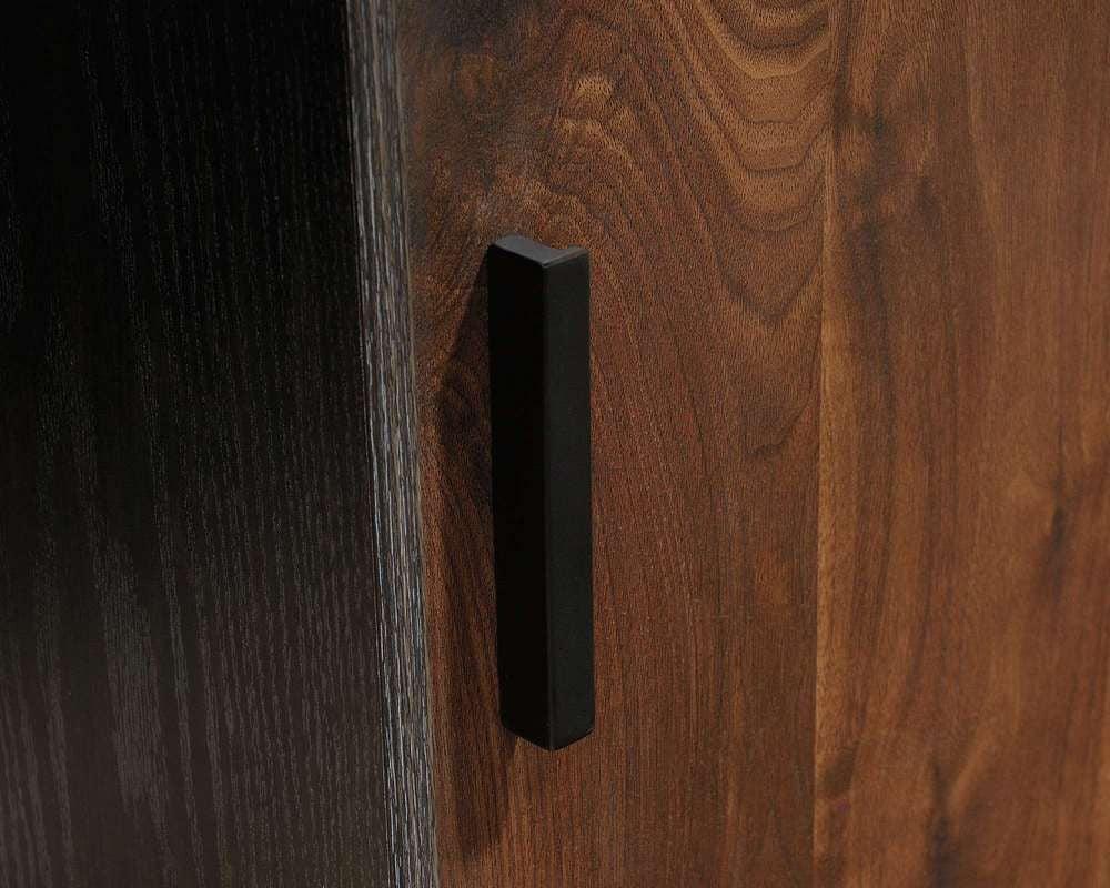 a close up of a door handle on a wooden door