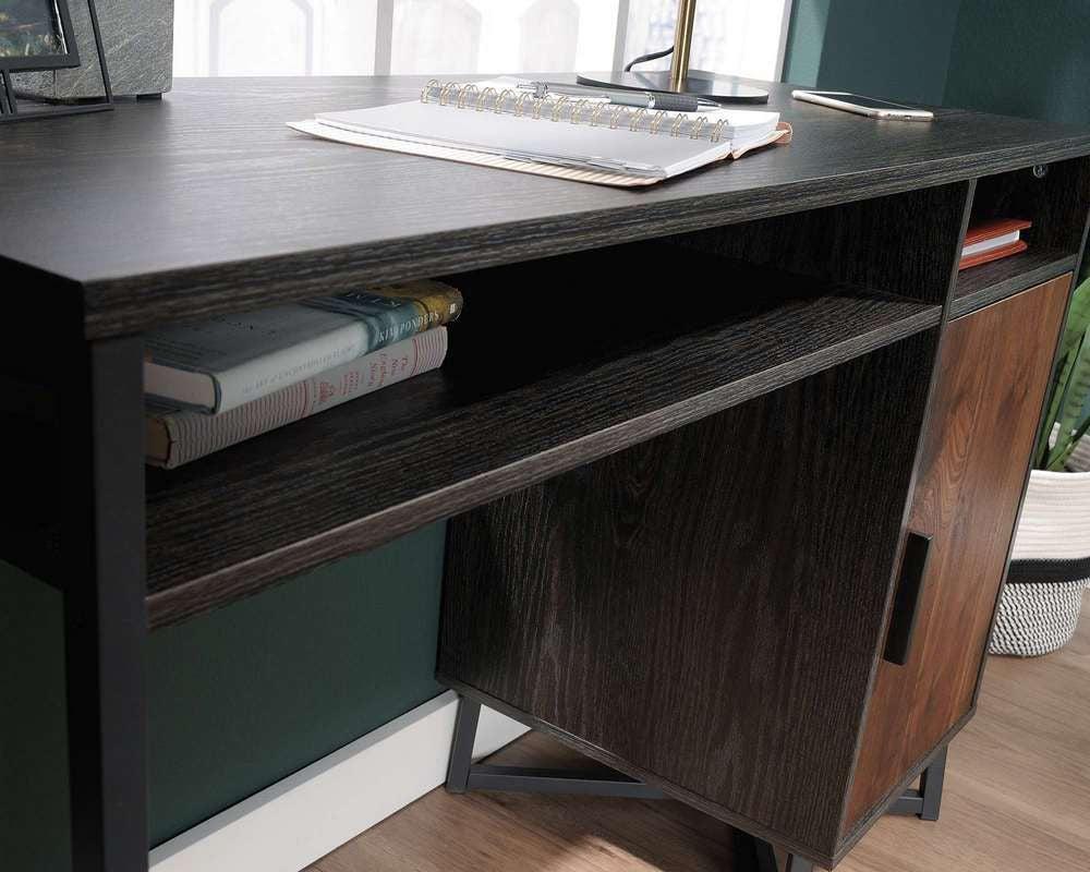 a wooden desk with a computer on top of it