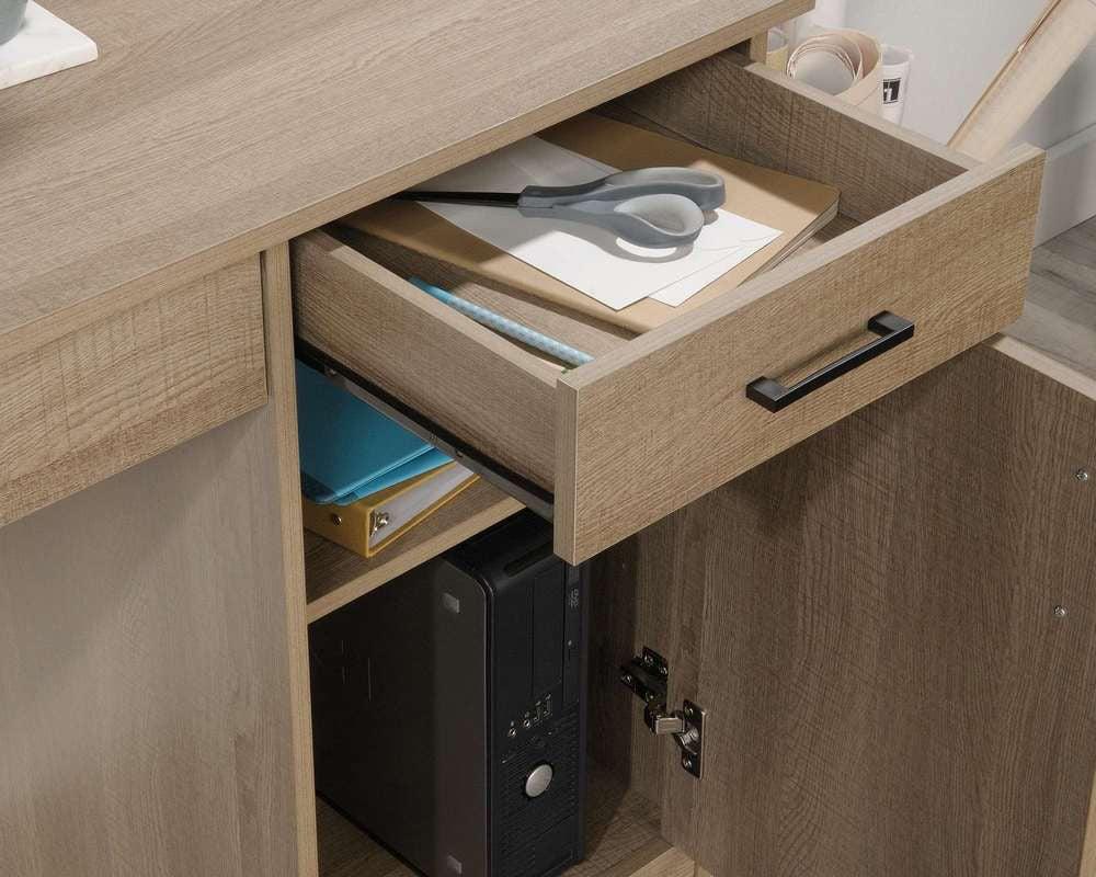 a desk with a drawer and a computer on top of it