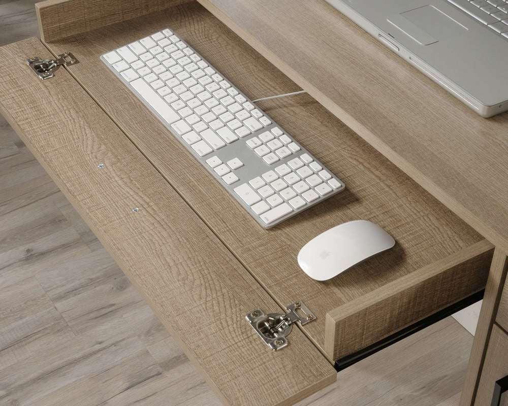 a desk with a keyboard and mouse on it