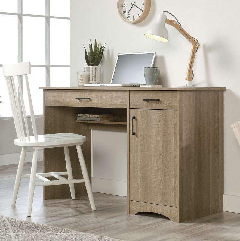 a desk with a laptop and a chair