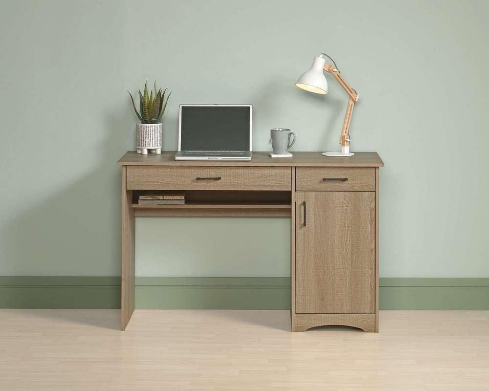 a computer desk with a laptop on top of it