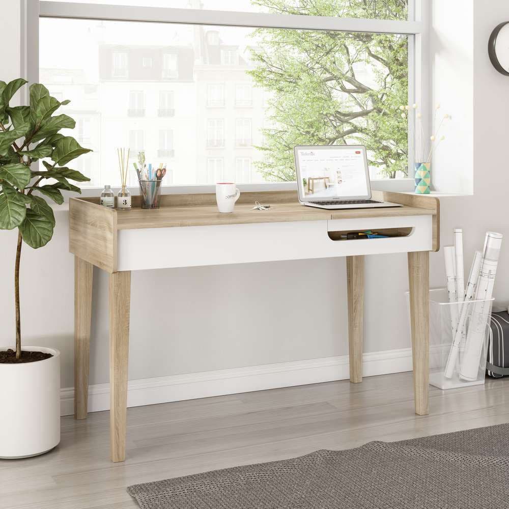 a white desk with a laptop on top of it