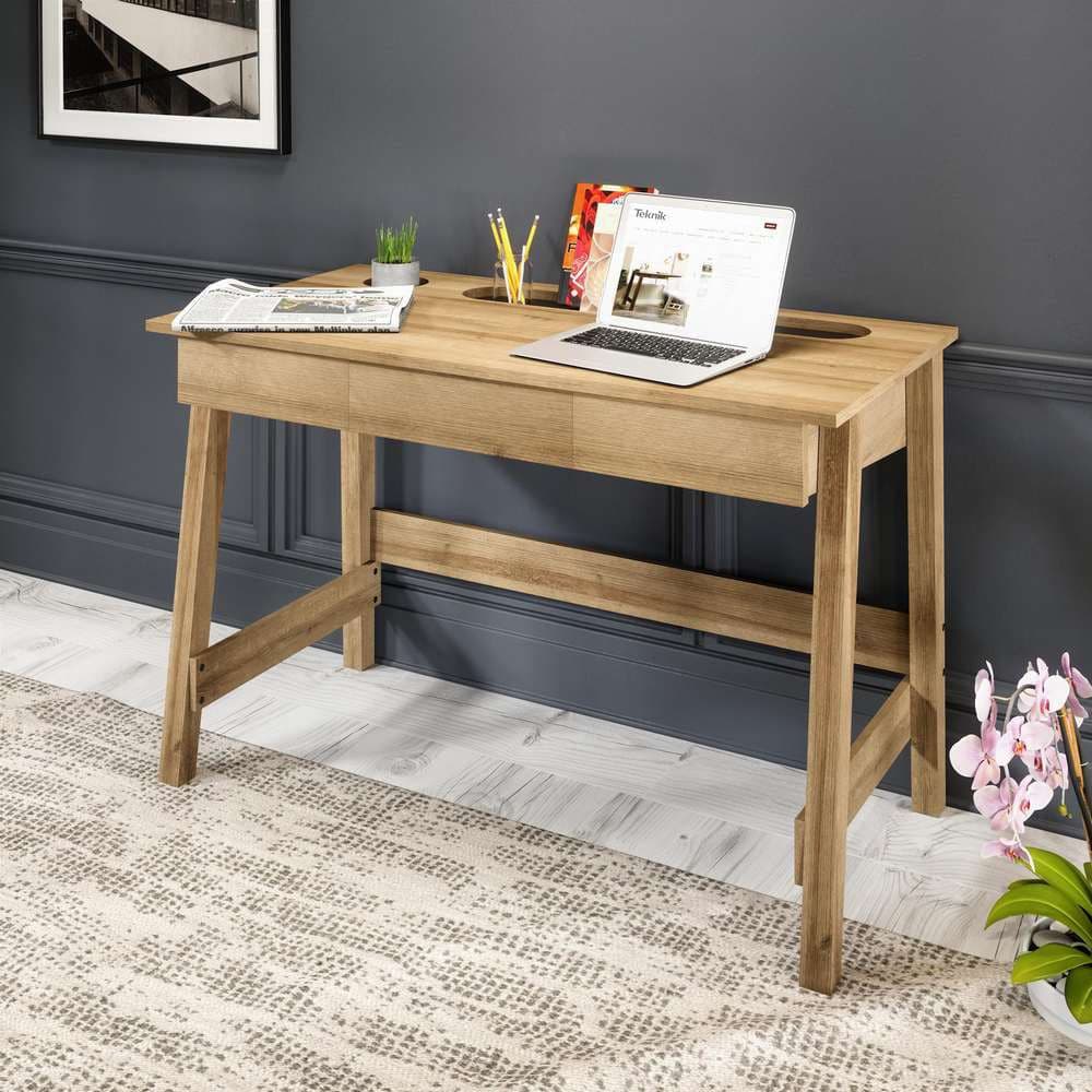 a laptop computer sitting on top of a wooden desk