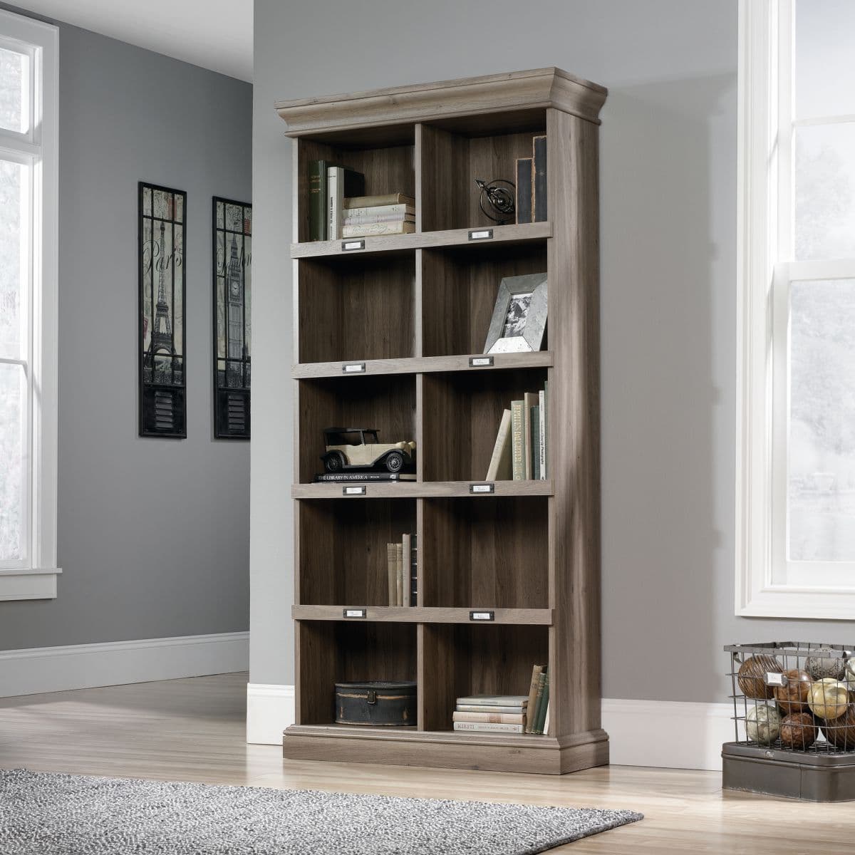 a bookcase in a room with a rug on the floor