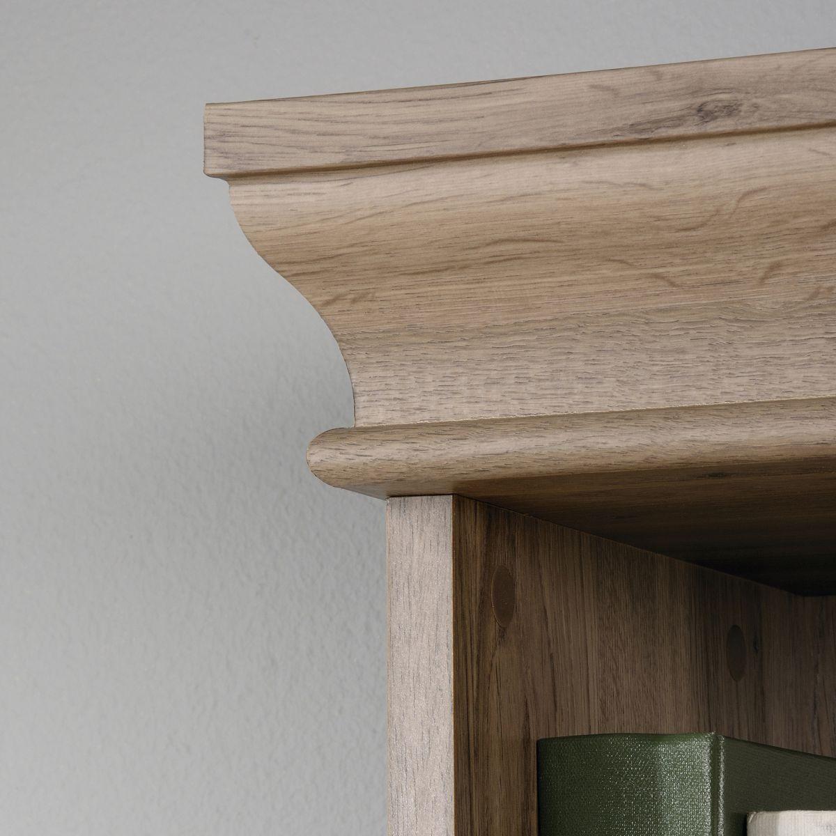 a close up of a wooden shelf with a book