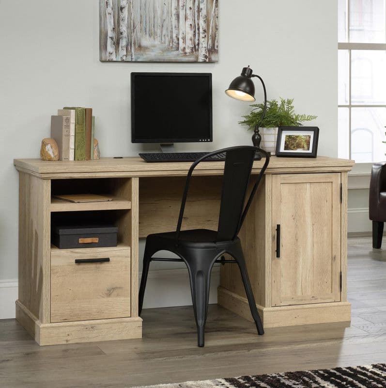 a computer desk with a computer on top of it