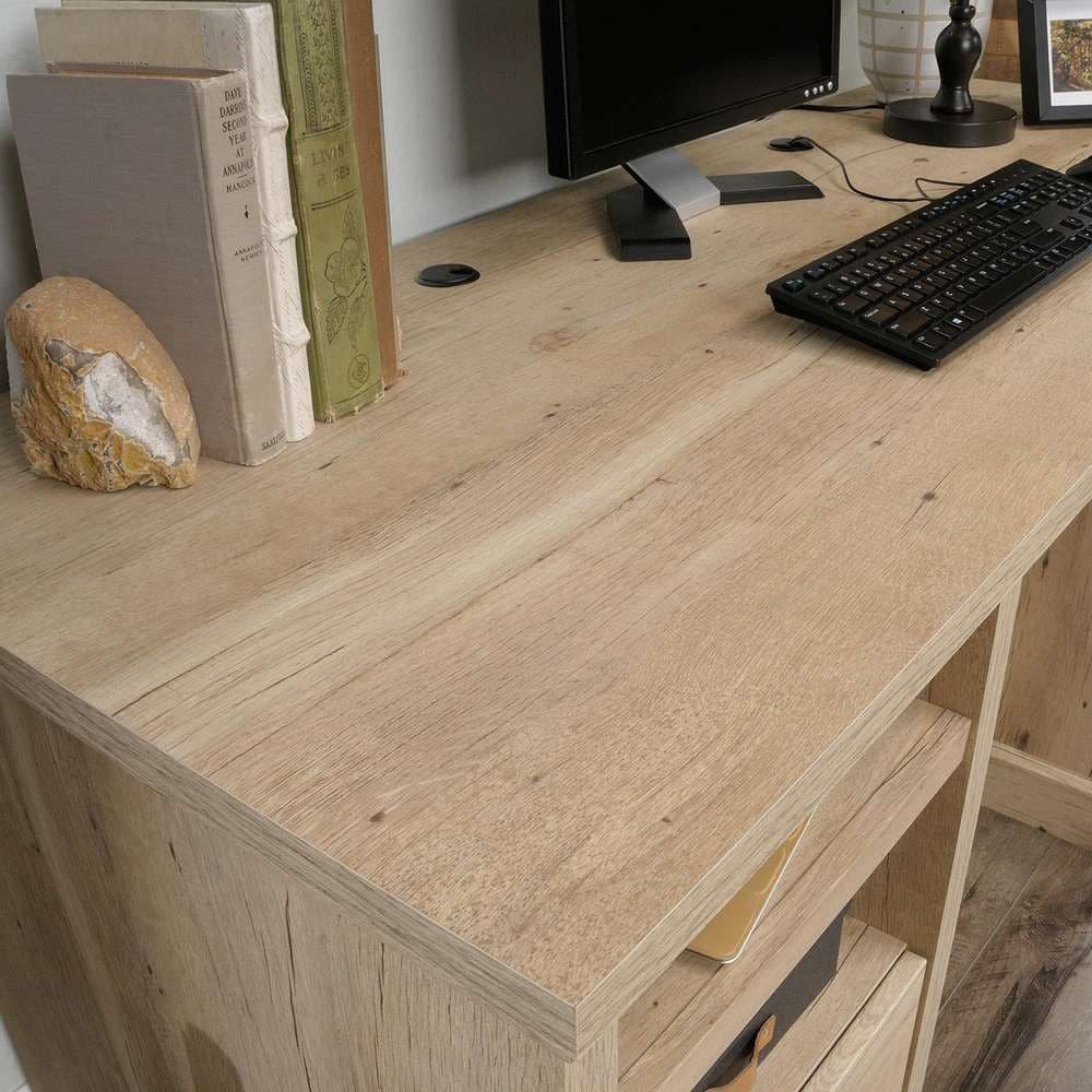 a computer desk with a keyboard and mouse