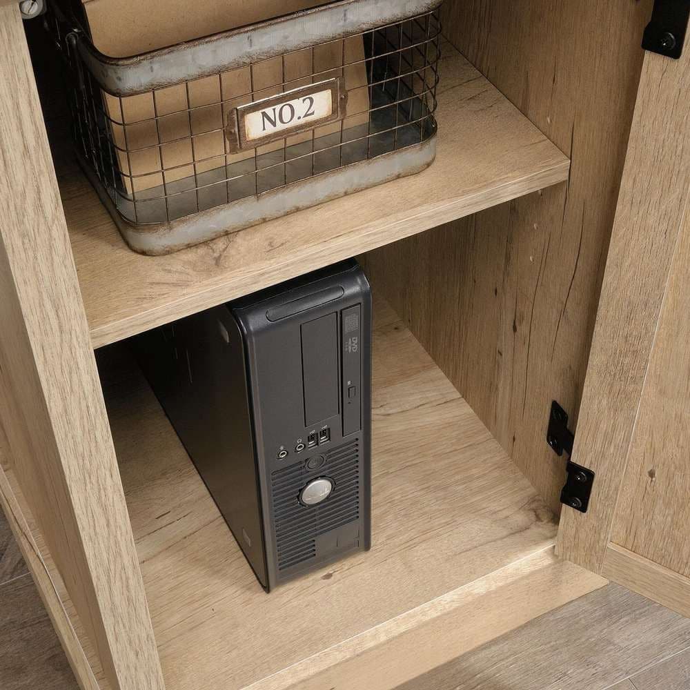 a desktop computer sitting on top of a wooden shelf