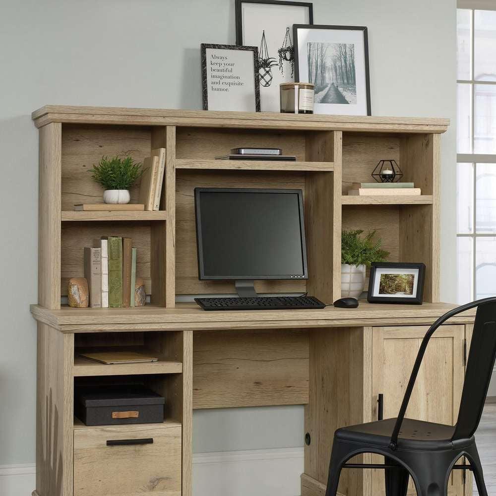 a computer desk with a computer on top of it