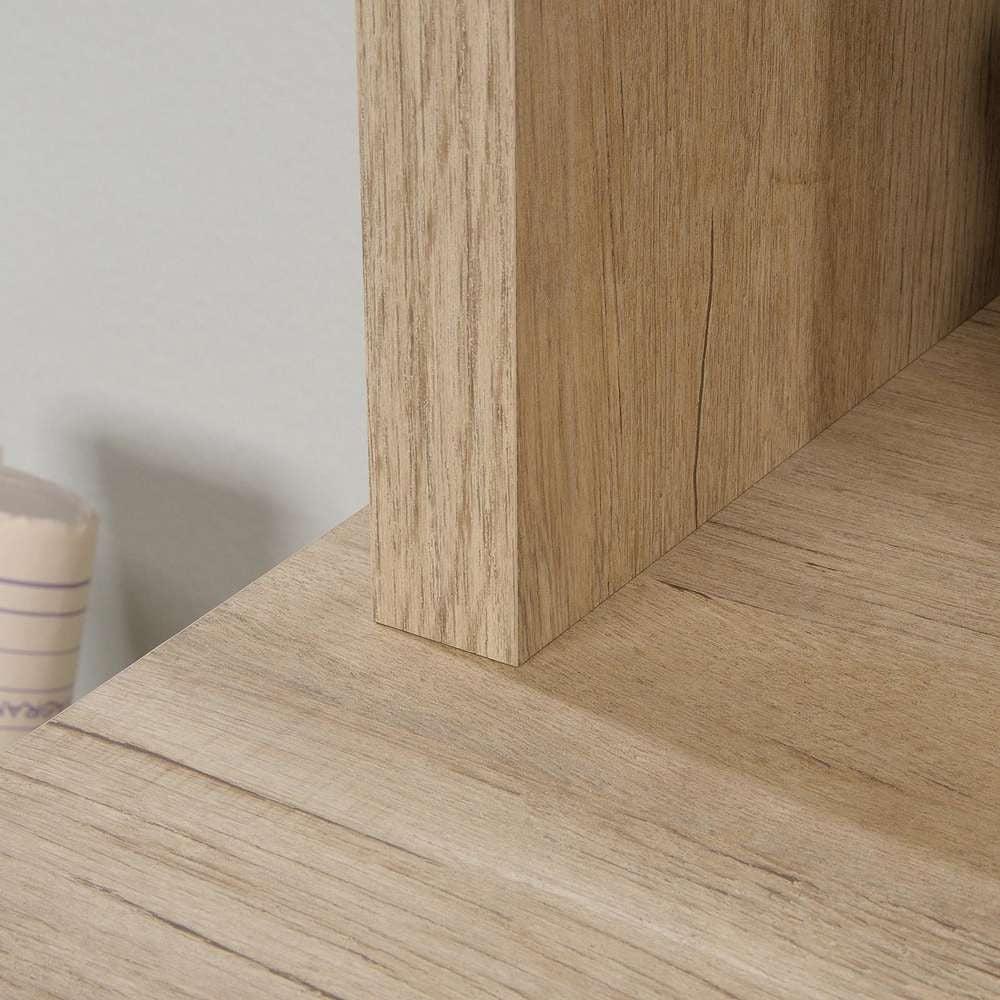 a close up of a wooden shelf with a cup next to it