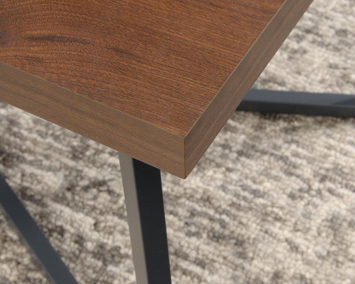 a close up of a wooden table with metal legs