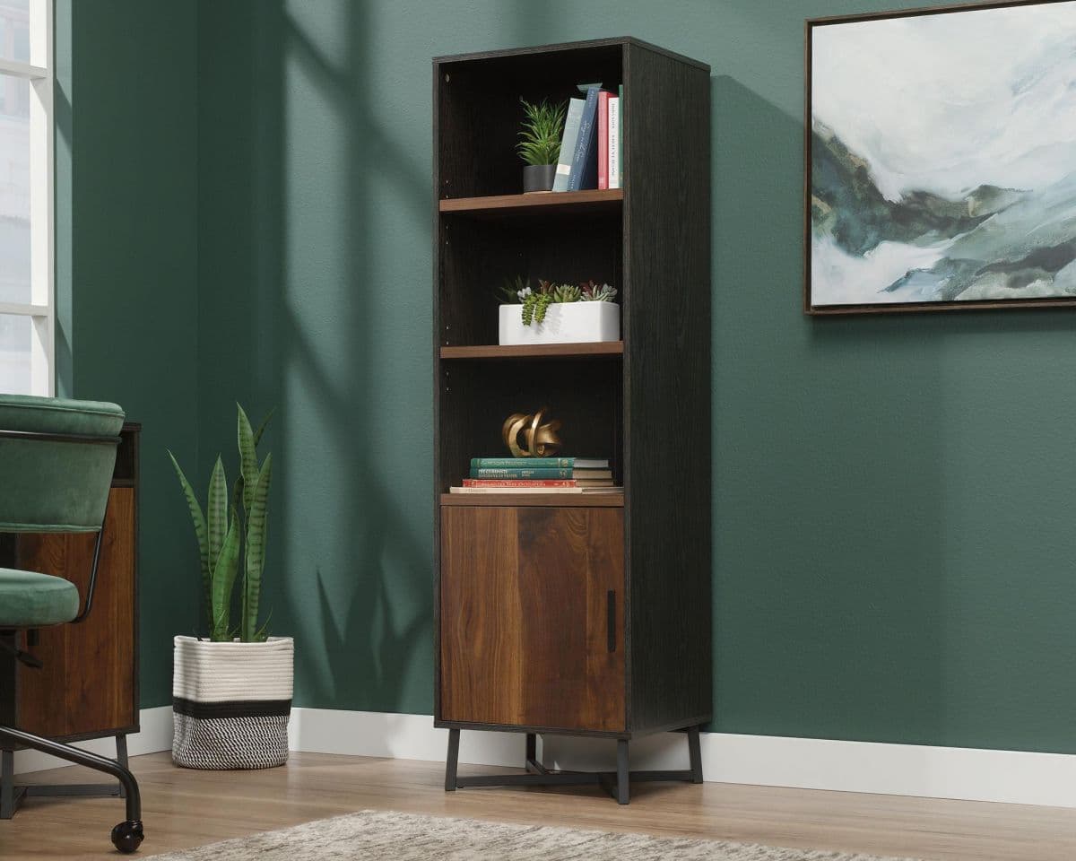 a room with a chair and a book shelf