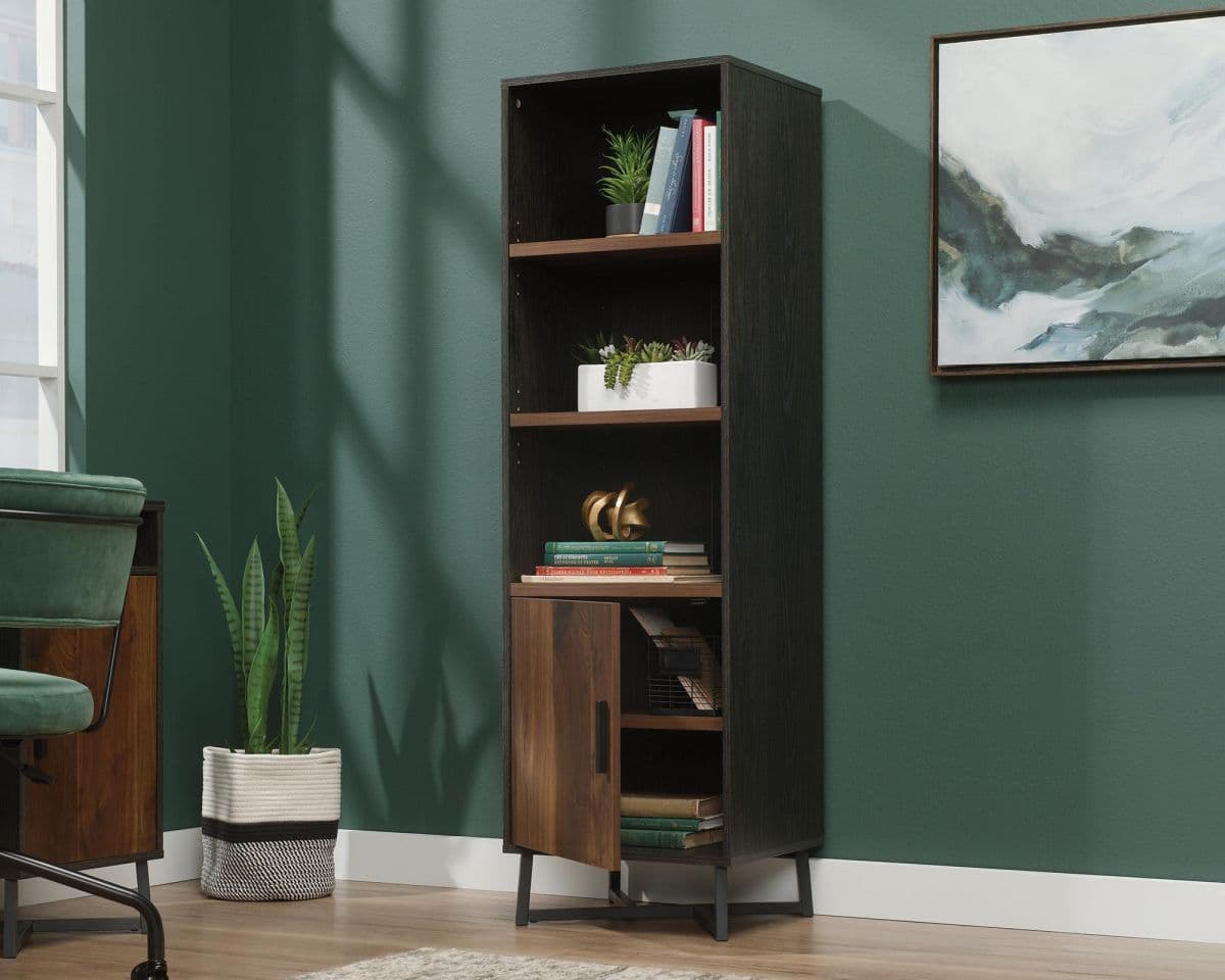 a room with a chair and a book shelf