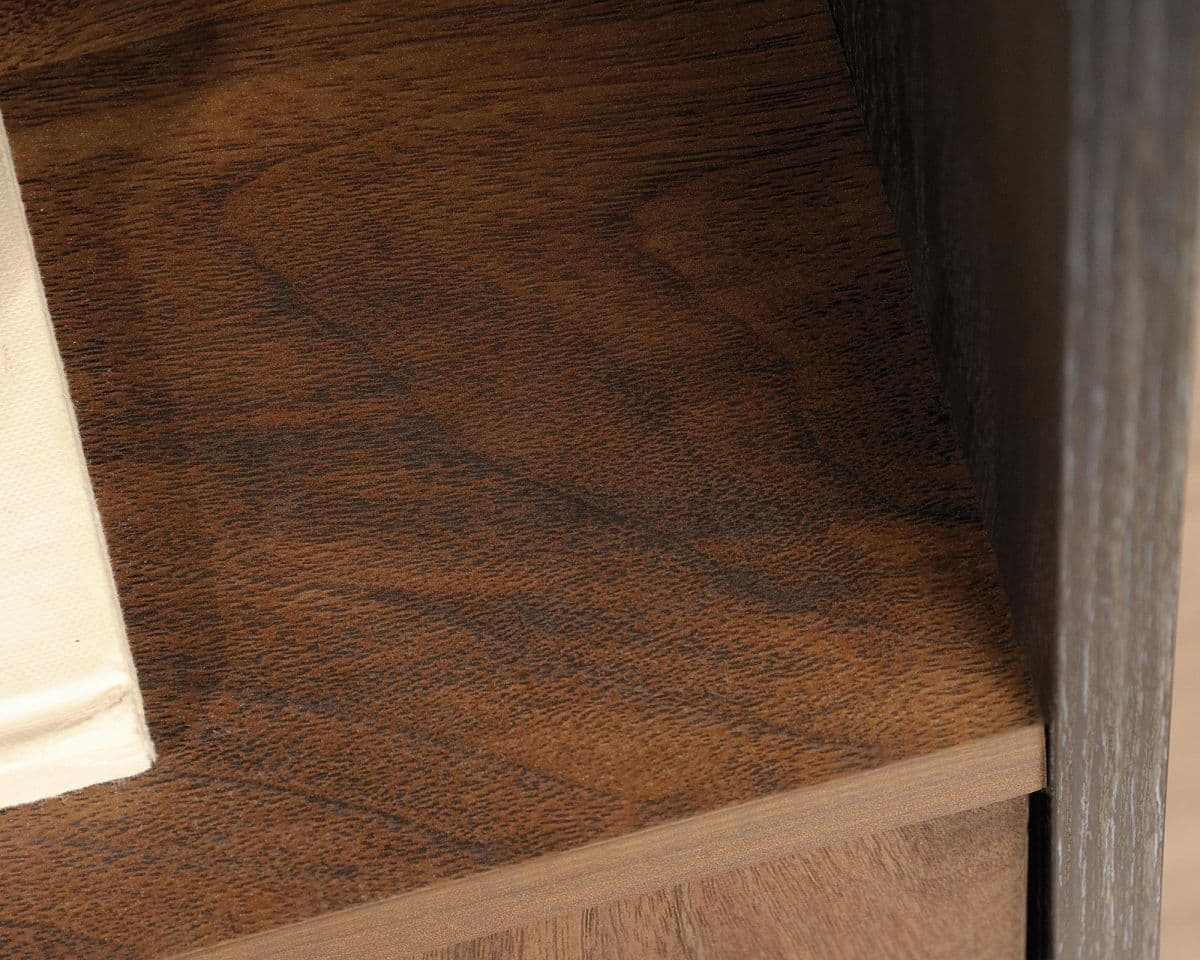 a close up of a wooden table with a towel on it