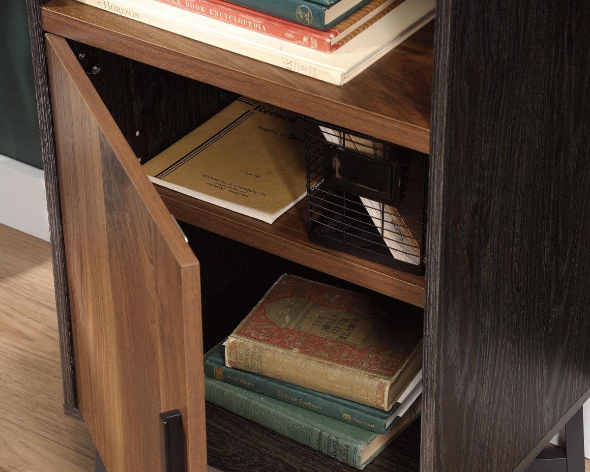 a bookshelf with a bunch of books on top of it