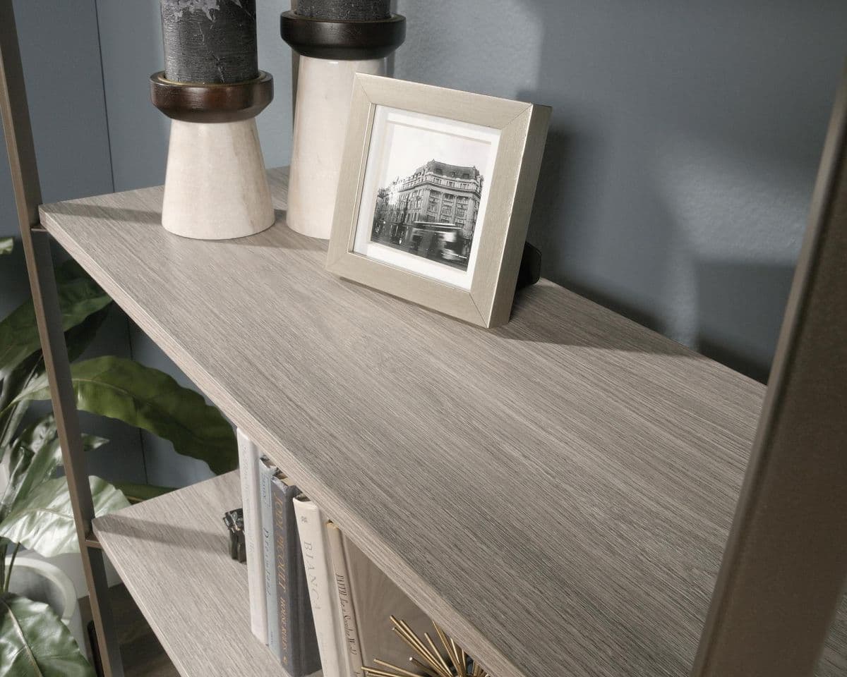 a shelf with a picture and a vase on top of it