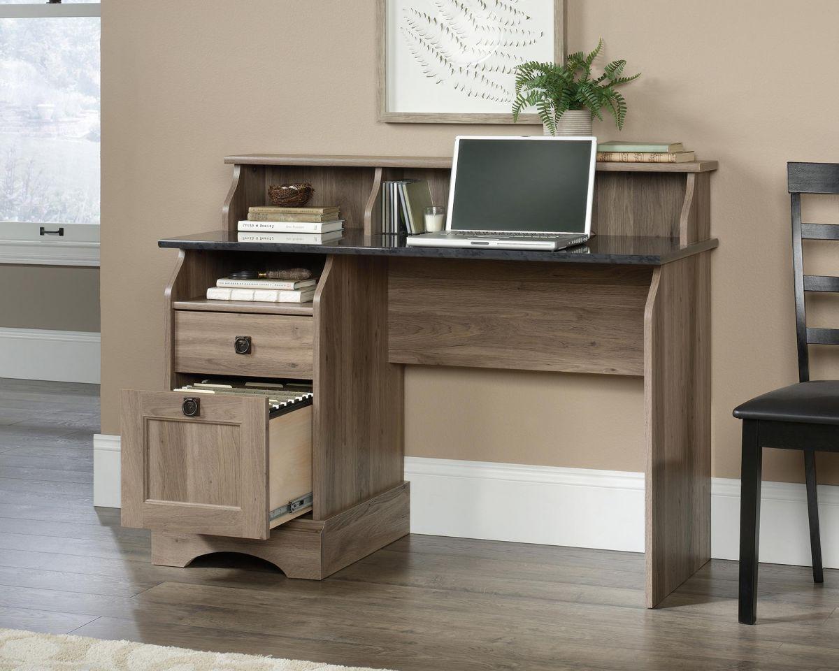 a computer desk with a laptop on top of it