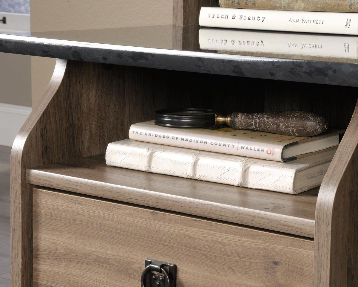 a book shelf with books and a magnifying glass on top of it