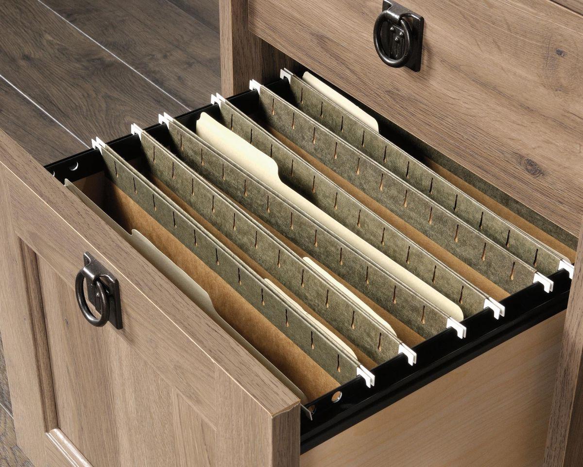 a drawer with files and folders inside of it