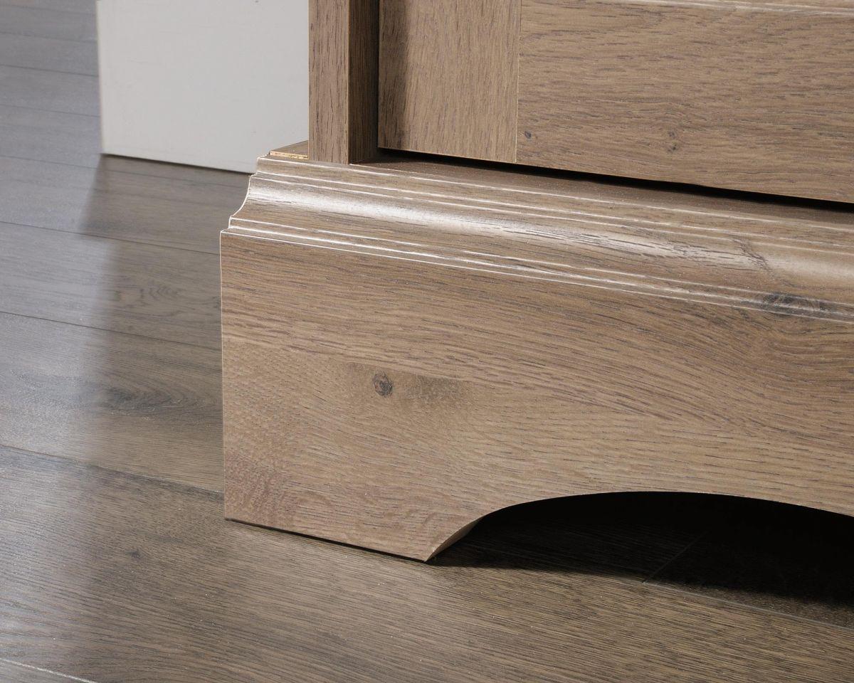 a close up of a drawer on a wooden floor