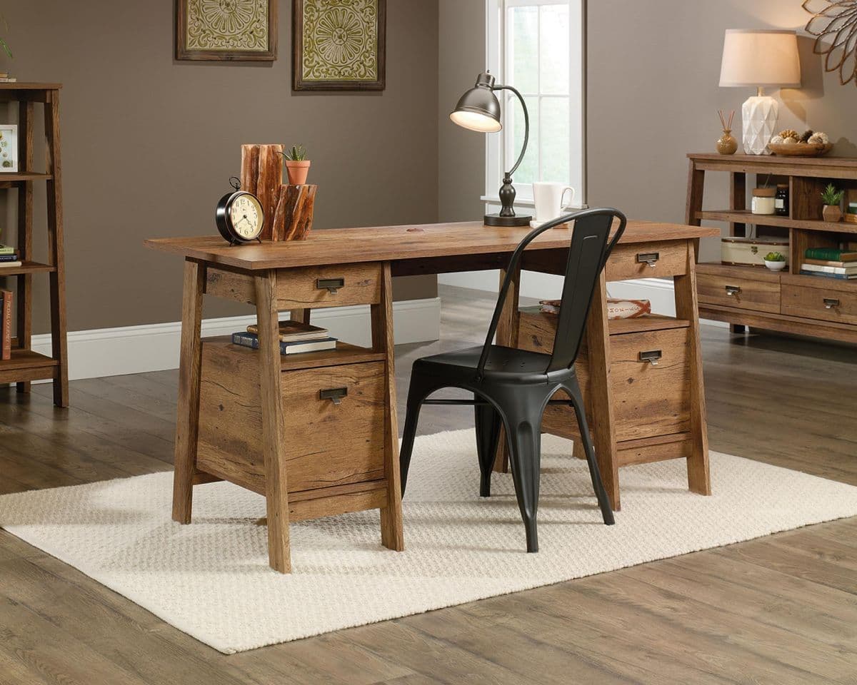 a wooden desk with a chair next to it