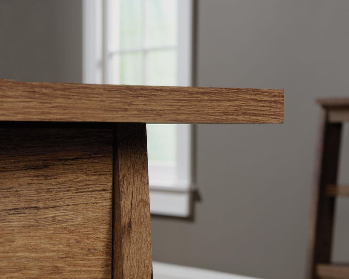 a close up of a wooden table in a room