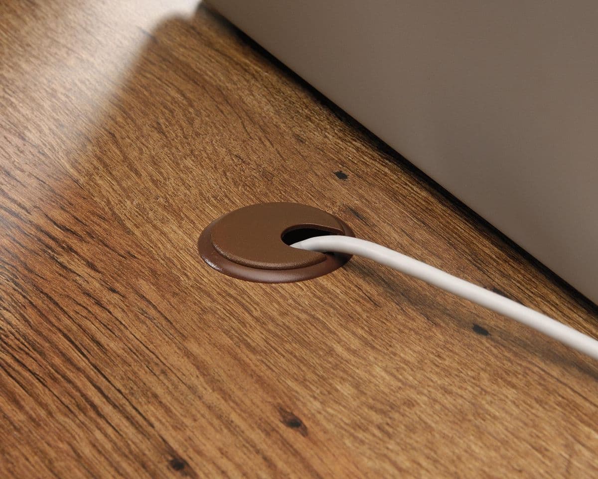 a close up of an apple laptop on a wooden table