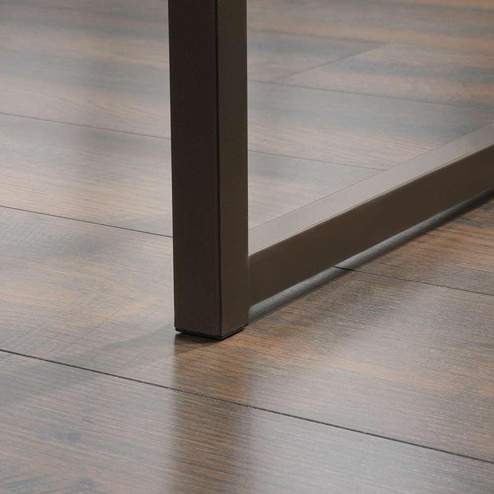 a close up of a wooden floor with a metal frame