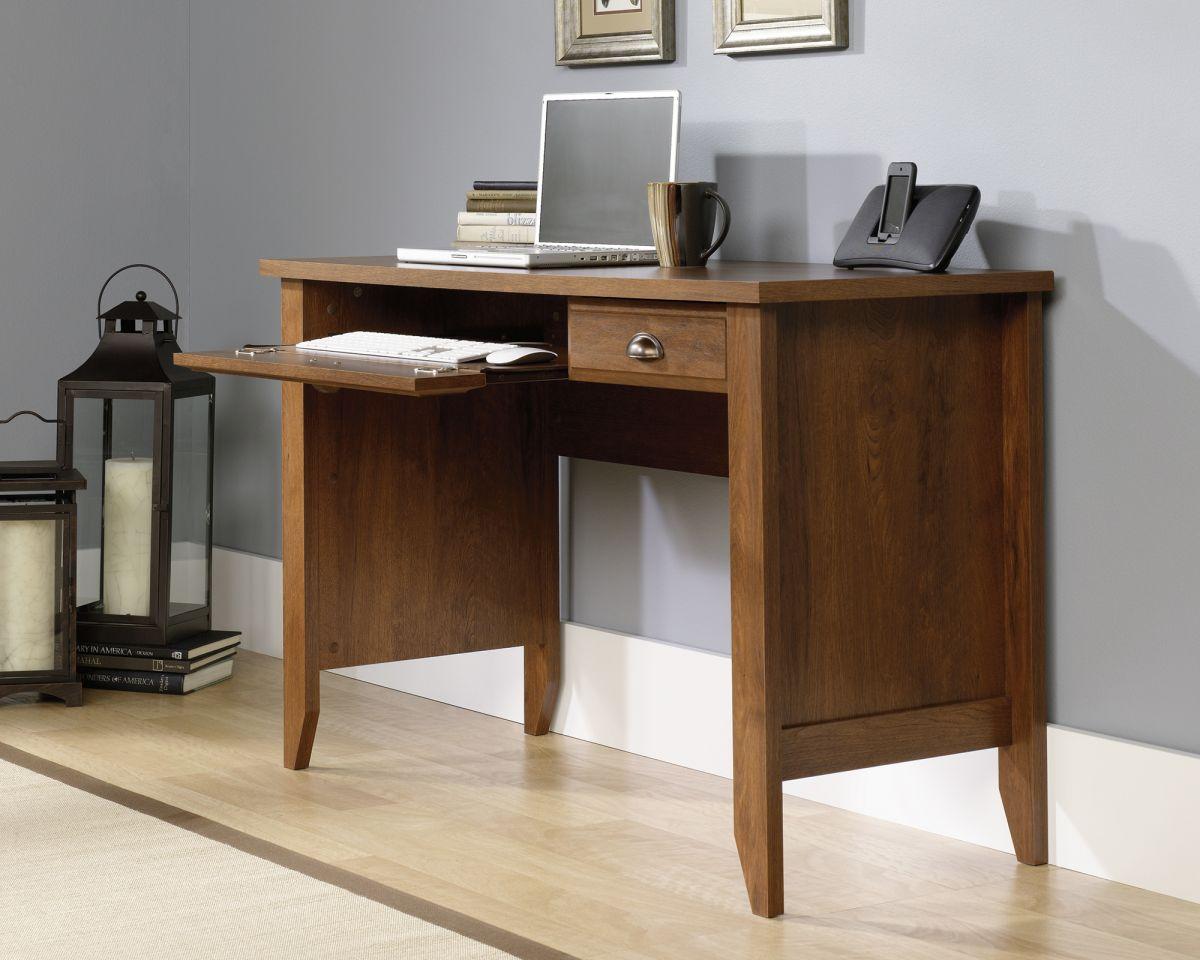 a wooden desk with a laptop on top of it