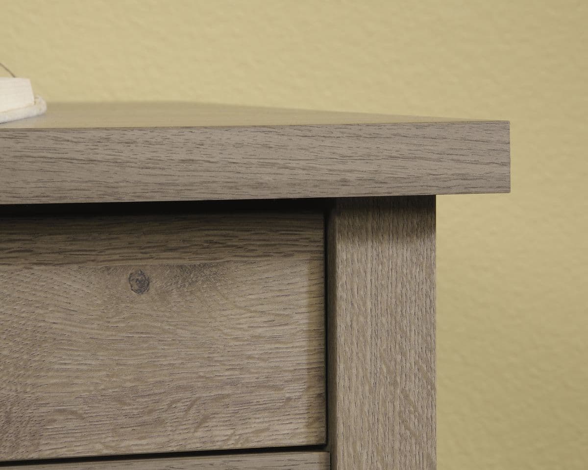 a wooden table with a book on top of it