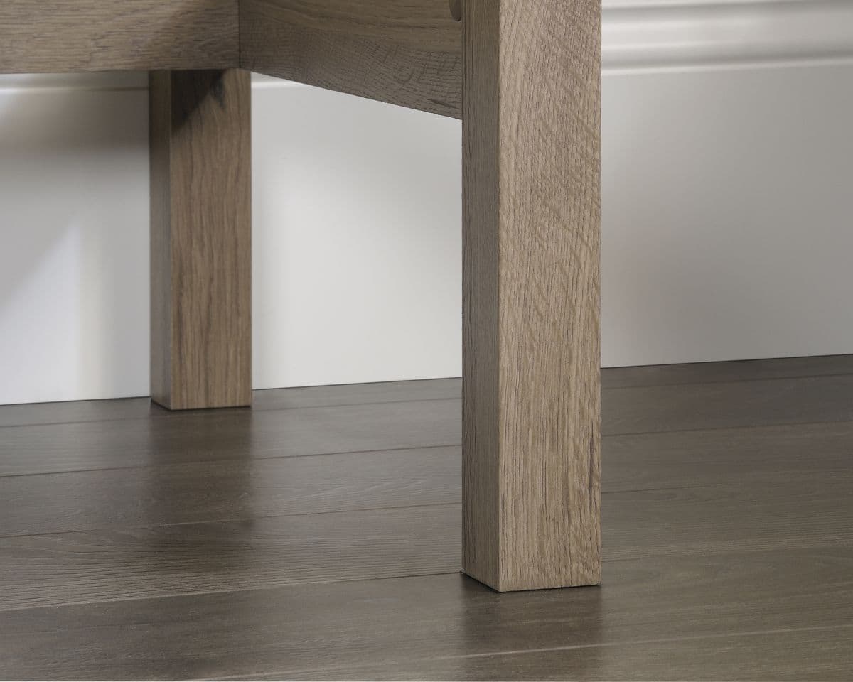 a close up of a wooden table on a hard wood floor