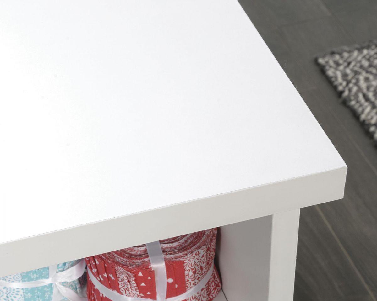 a close up of a white table with wrapped presents