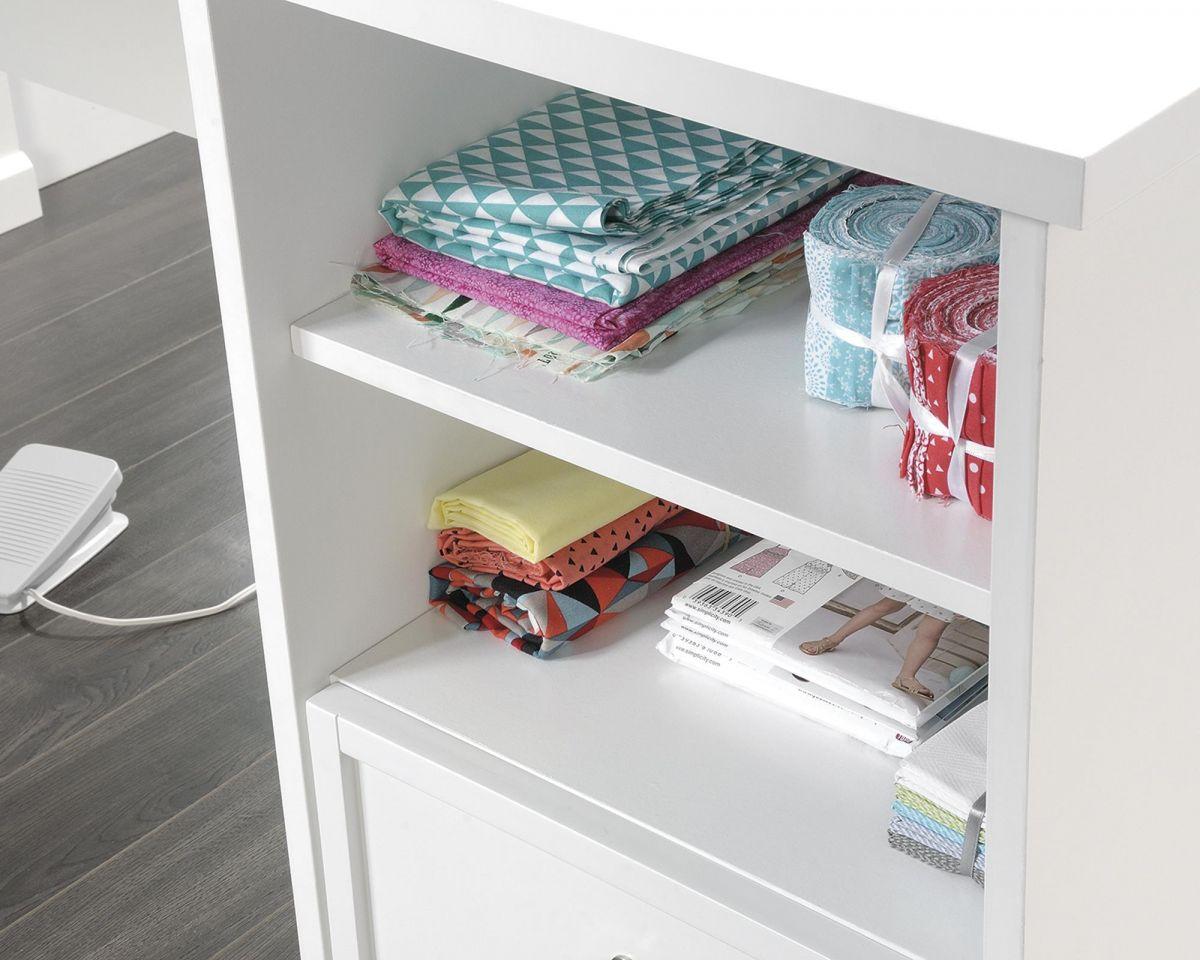 a white book shelf filled with lots of books