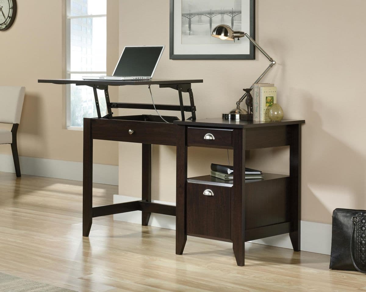 a computer desk with a laptop on top of it