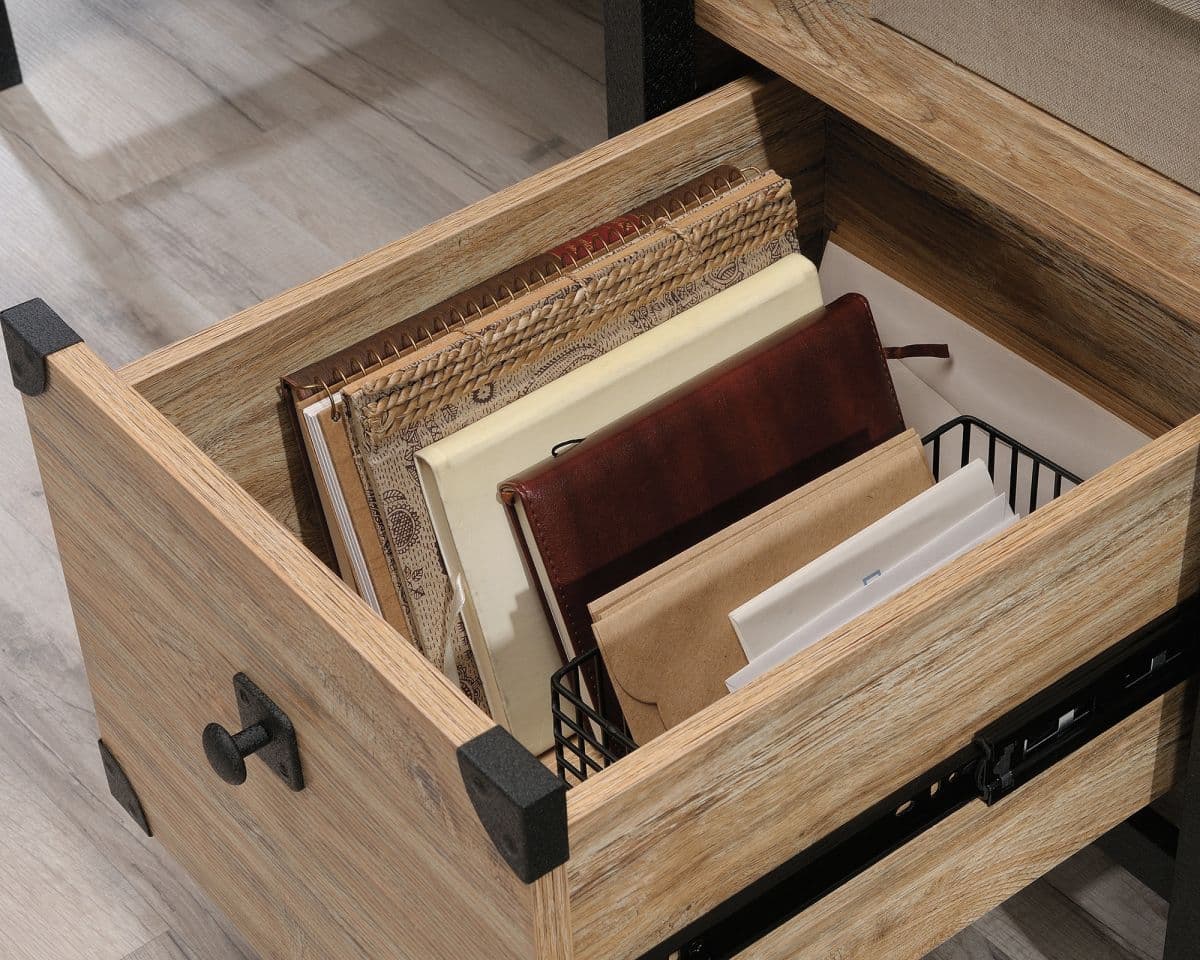 a wooden drawer with files and folders in it