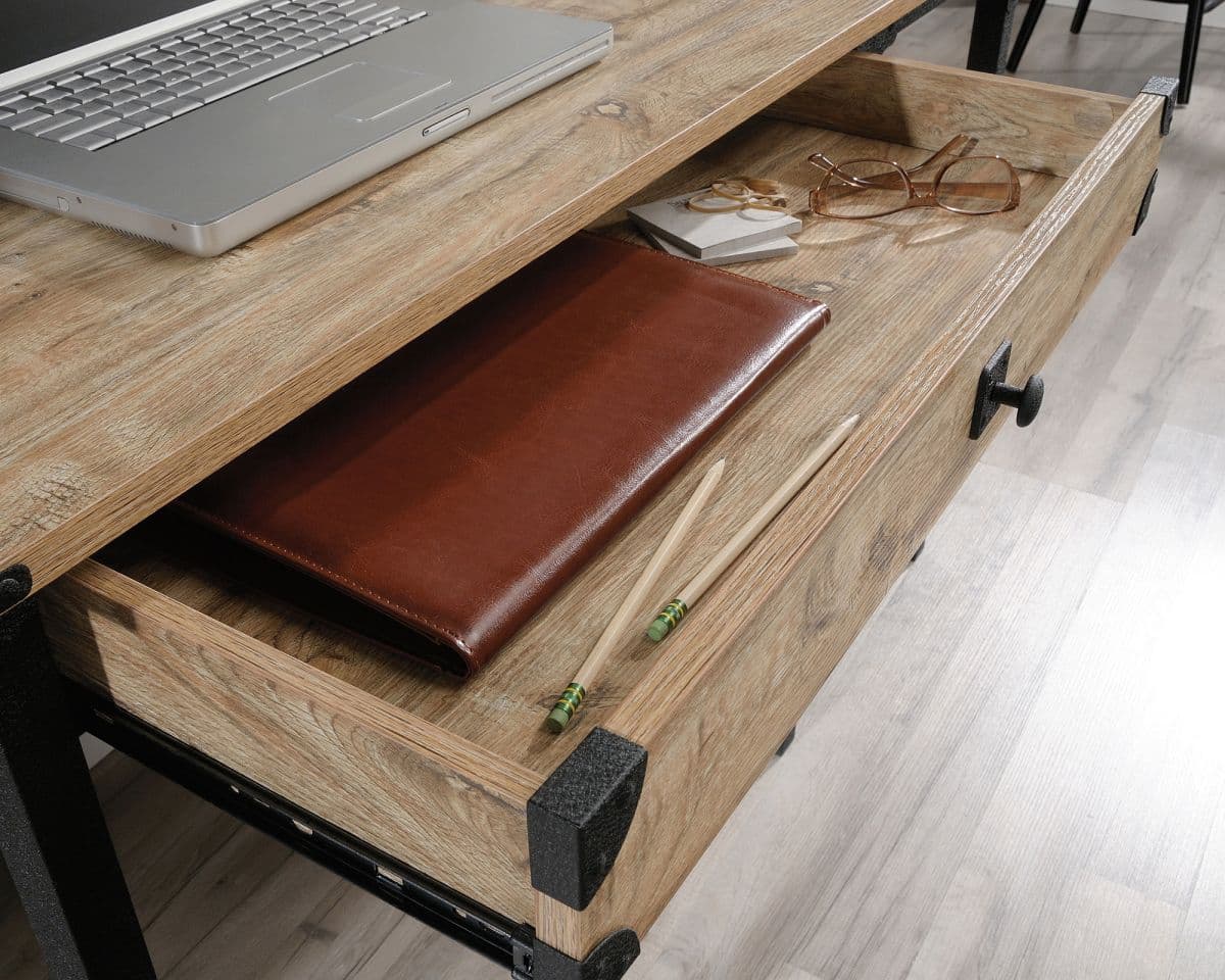 a laptop computer sitting on top of a wooden desk