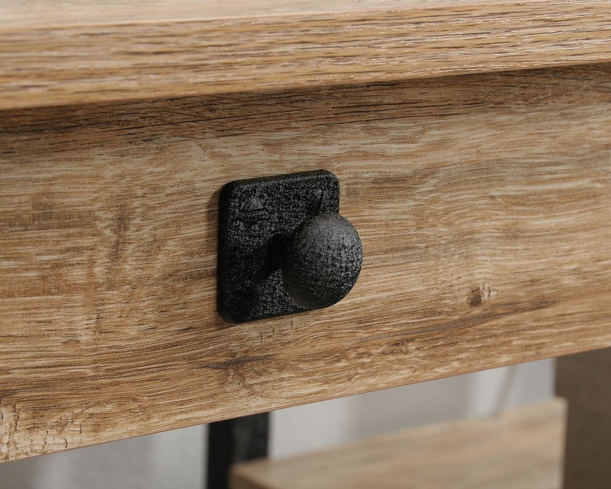 a close up of a wooden table with a black knob