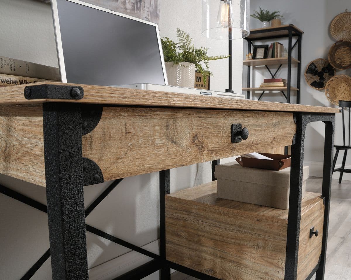 a wooden desk with a laptop on top of it