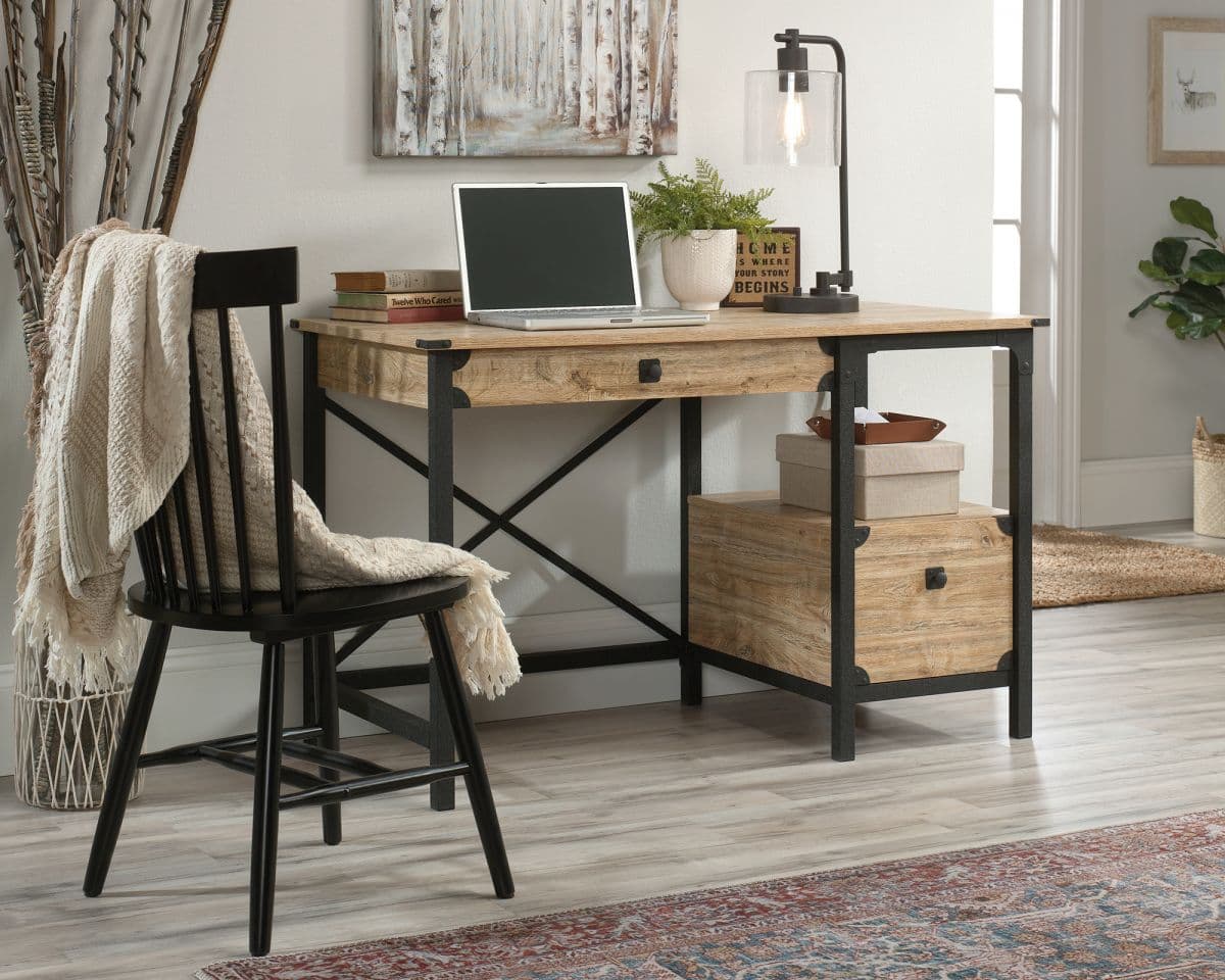 a desk with a laptop on top of it