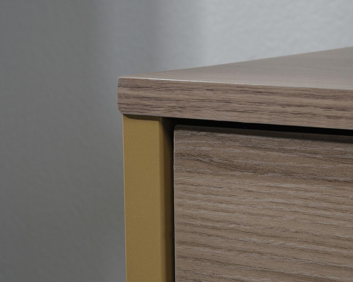 a close up of a wooden cabinet with a white wall in the background