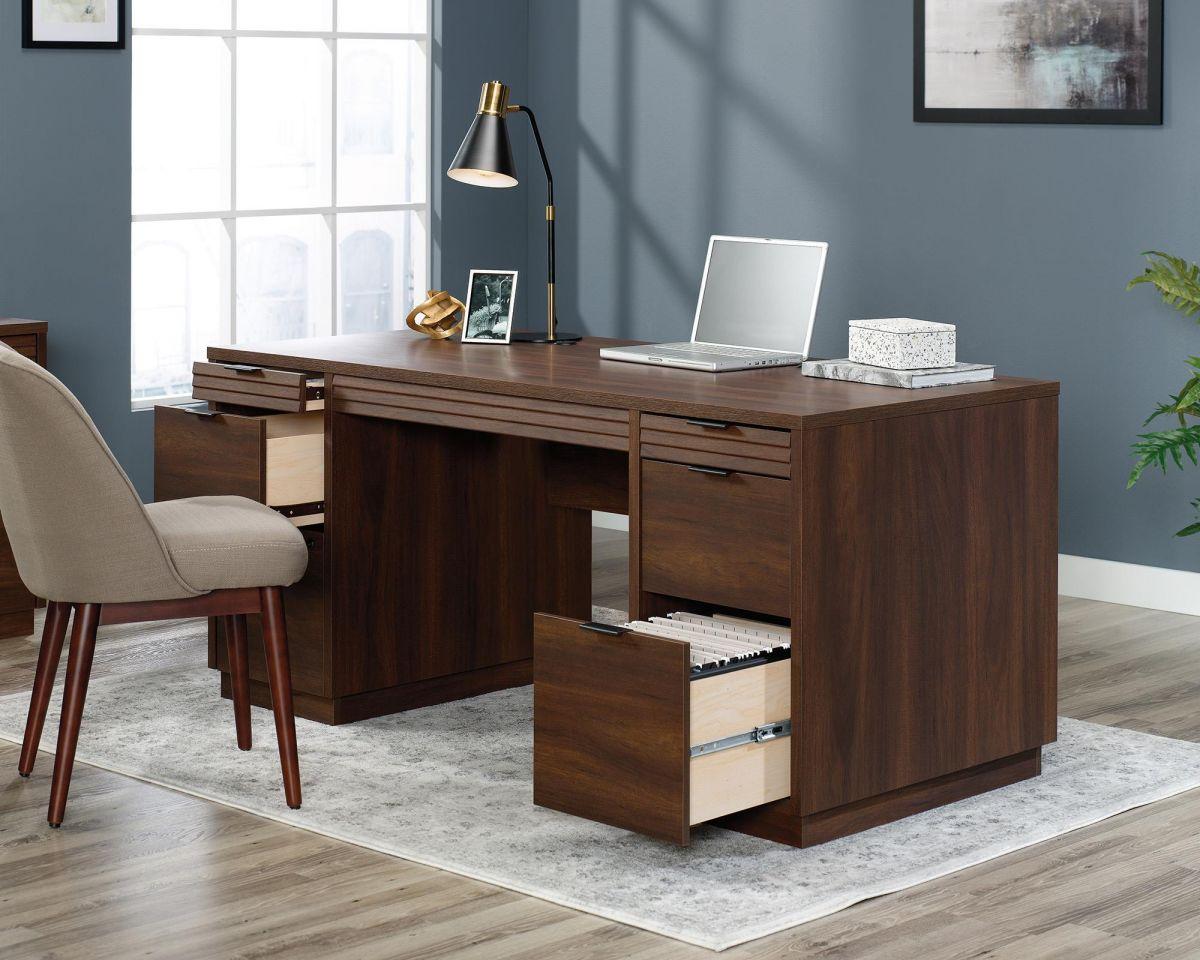 a wooden desk with a laptop on top of it