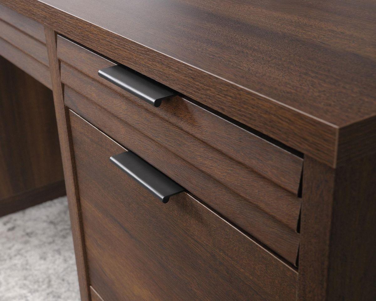 a close up of a wooden desk with two drawers