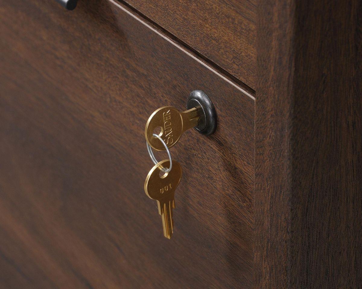 a close up of a drawer with a key on it