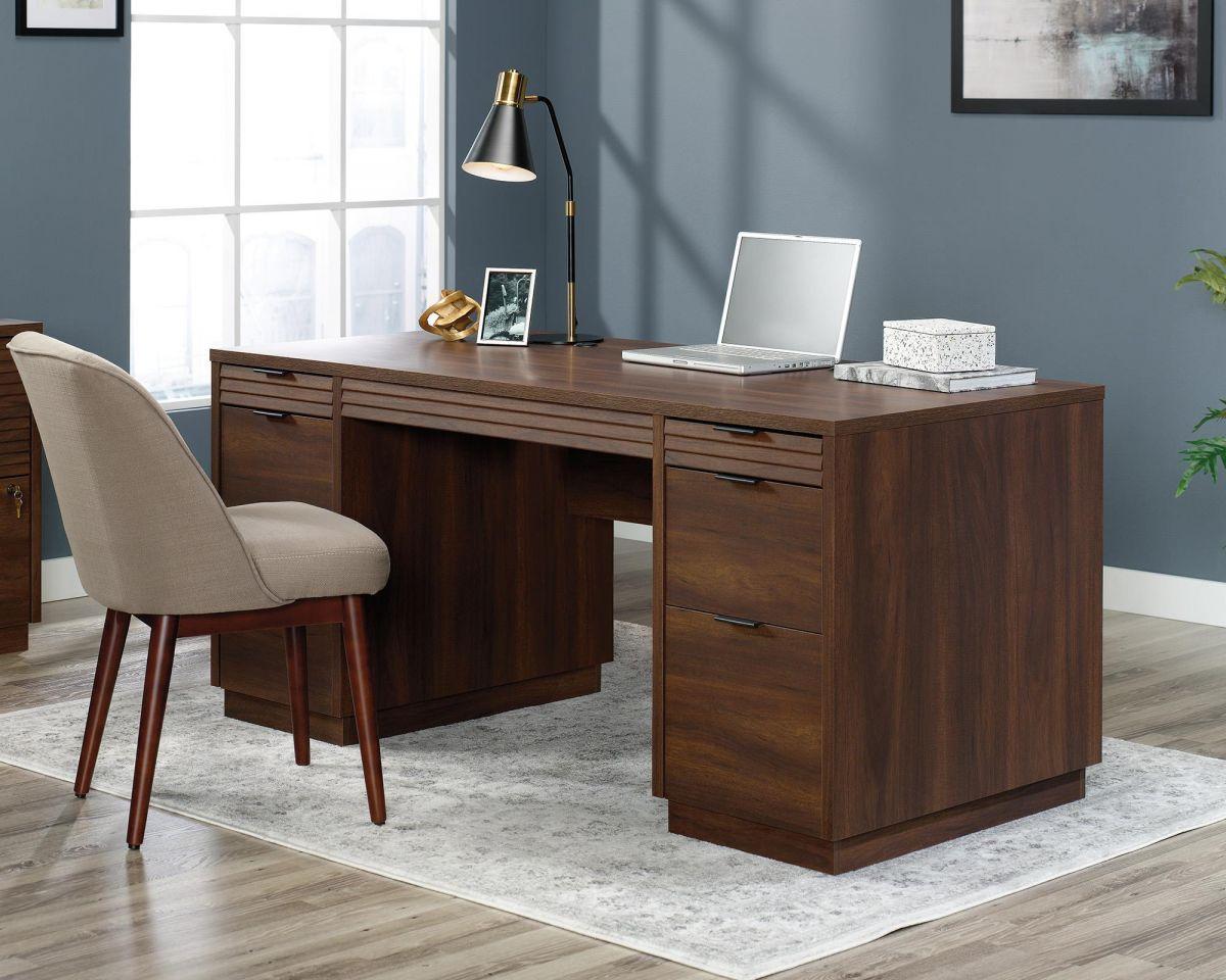 a wooden desk with a laptop on top of it