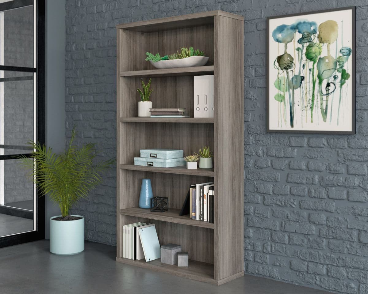 a room with a brick wall and a book shelf