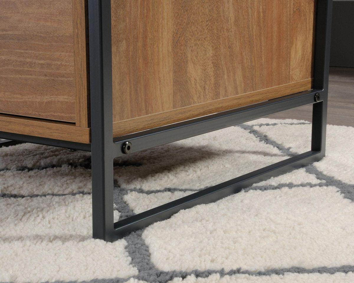 a wooden dresser sitting on top of a white rug