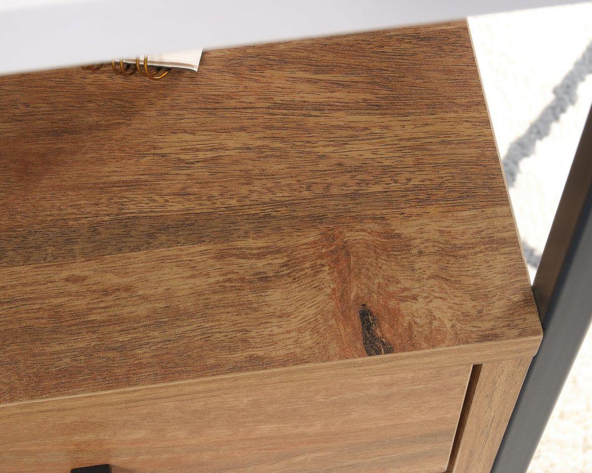 a close up of a wooden table with a book on it