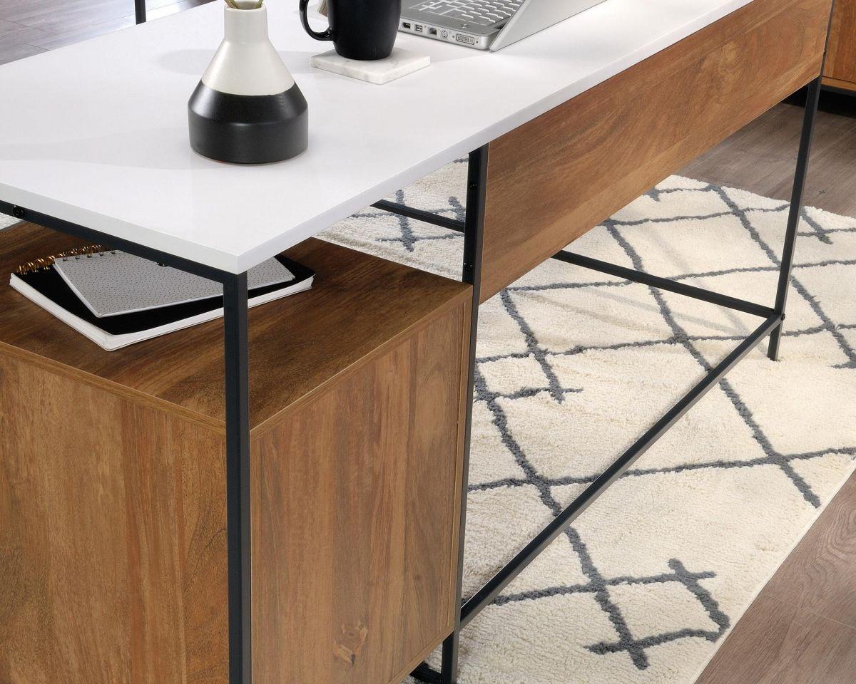 a modern desk with a laptop on it