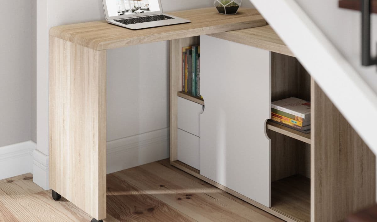 a laptop computer sitting on top of a wooden desk